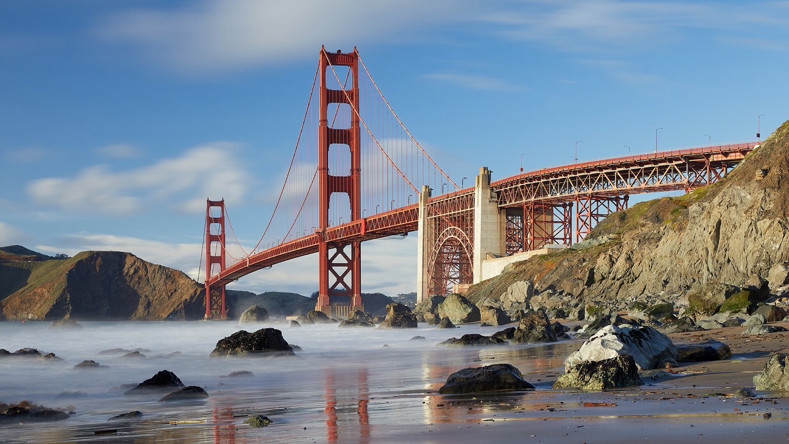 The Golden Gate Bridge seen from a rocky beach